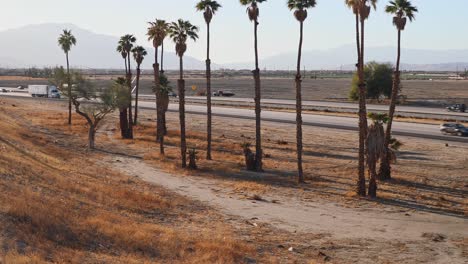 Interstate-10-highway-in-Coachella-Valley-barren-desert-landscape,-California