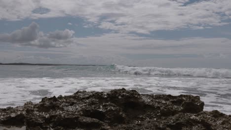 Rocky-Shore-With-Crashing-Sea-Waves-In-Cloudscape-Sky-In-Mediterranean-Sardinia-Island,-Italy