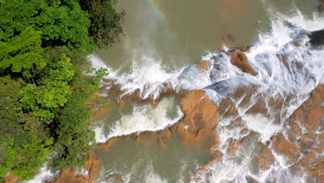 Tilting-downward-drone-shot-drone-shot-of-the-waterfalls-found-at-Cascadas-de-Agua-Azul-on-the-Xanil-River-in-Chiapas-Mexico