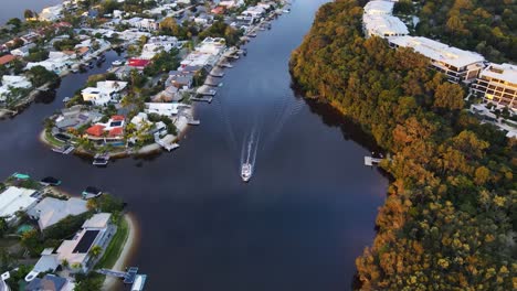 Boat-Cruising-On-Waterways-In-Noosa-Heads,-Sunshine-Coast,-Queensland-With-Luxury-Accommodations-And-Resort-In-Mossman-Park