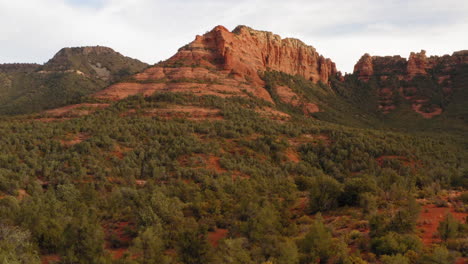 Aerial:-rocky-mountain-valley-with-forest-at-Grasshopper-Point,-Sedona---drone-flying-shot