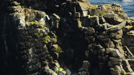 Slow-dolly-out-shot-of-the-Icelandic-sea-stack-Hvitserkur-on-the-Vatnsnes-peninsula,-layered-basalt-rock-formation