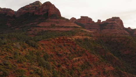 Aerial-landscape:-mountain-valley-with-forest-at-Sedona,-Arizona---drone-flying-shot