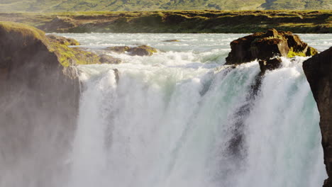 Dramatic-close-up-clip-of-the-head-of-the-Godafoss-Waterfall-in-Iceland-as-the-Skjálfandafljót-river-flows-over
