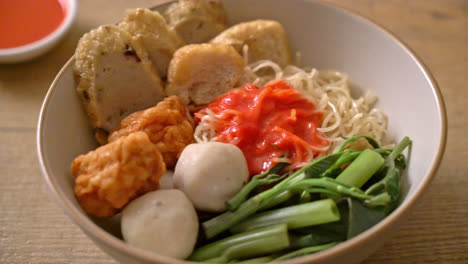 egg-noodles-with-fish-balls-and-shrimp-balls-in-pink-sauce,-Yen-Ta-Four-or-Yen-Ta-Fo---Asian-food-style