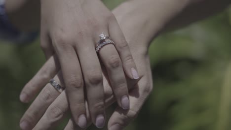 bride-and-groom-hands-with-wedding-rings