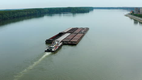 Tugboat-Pushing-Massive-Barges-On-Danube-River-Near-Vukovar-City,-Croatia