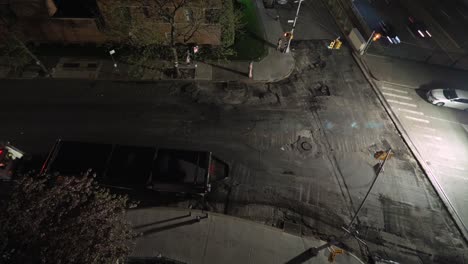 Time-lapse-of-a-city-street-being-paved-with-fresh-asphalt-during-the-night