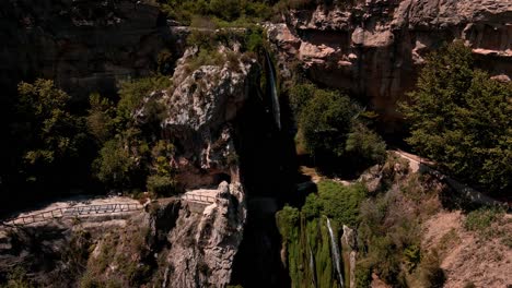Aerial-views-of-waterfalls,-nature-and-lagoons-in-a-natural-park-in-Catalonia