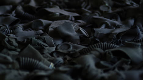 Push-in-shot-of-abandoned-gas-masks-lining-the-floors-of-Pripyat-after-the-Chernobyl-Nuclear-disaster-of-1986