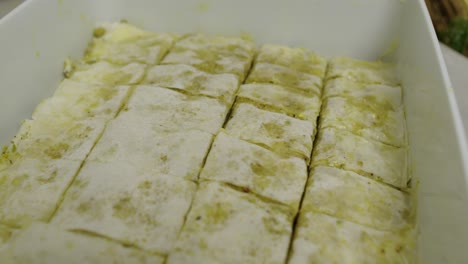 Close-up-on-cut-baklava-slices-inside-cooking-ceramic-tray