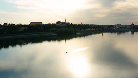 Man-Rowing-Boat-In-Danube-River-Near-Vukovar-City-During-Sunset-In-Croatia