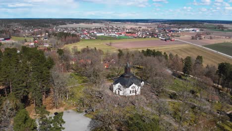 Aerial-panoramic-view-of-Erska-Church-in-countryside-near-city-landscape-of-Sollebrunn