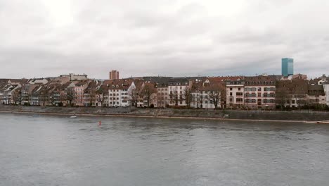 Rhine-river-against-riverside-Basel-cityscape,-Switzerland