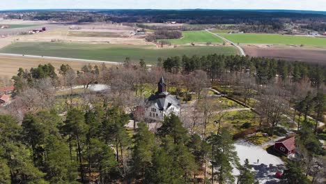 Panoramic-aerial-view-of-Sollebrunn,-Sweden-Landscape-and-Erska-Church