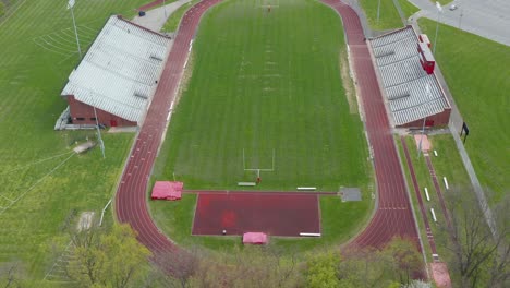 Aerial-tilt-up-reveals-athletic-track-and-field
