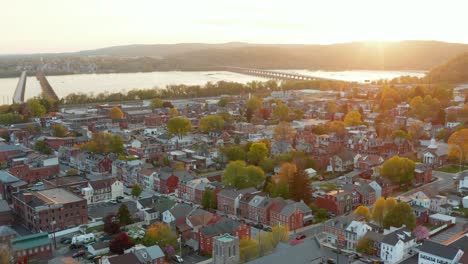 Cinematic-aerial-of-historic-American-city-during-spring-sunset,-sunrise