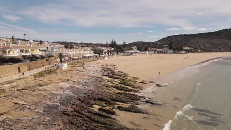 Unspoiled-calm-Praia-Da-Luz,-quiet-sand-beach-and-beautiful-ocean
