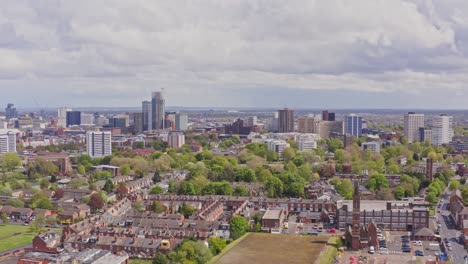 Aerial-drone-rising-pedestal-shot-of-Birmingham-city-skyline-on-overcast-day,-England