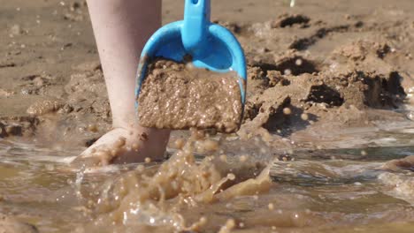 The-child-was-playing-with-wet-sand