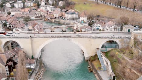 Bern-Old-Town---Nydeggbrucke-arched-freestone-bridge-with-city-and-river-view