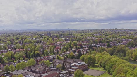 Aerial-drone-shot-rising-over-typical-British-suburb-residential-housing-estate