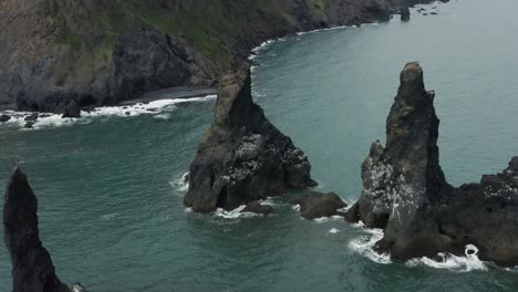 Famous-Iceland-rock-formation-Reynisdrangar-on-south-shore,-aerial