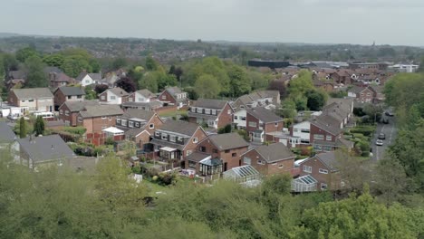 Quiet-British-homes-and-gardens-residential-suburban-property-aerial-view-wide-left-orbit