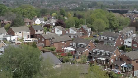 Quiet-British-homes-and-gardens-residential-suburban-property-aerial-view-rising-right