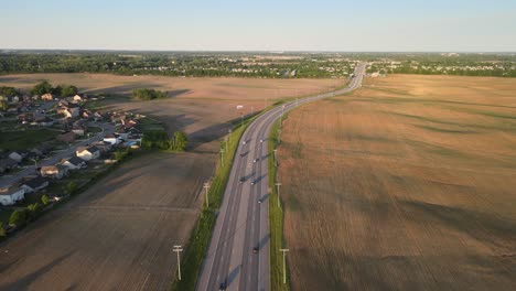 Aerial-footage-of-suburban-road-in-Clarksville,-Tennessee-during-the-golden-hour