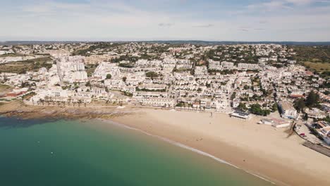 Panoramic-aerial-view-of-Praia-da-Luz-beach,-Lagos,-Algarve