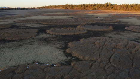 Aerial-backwards-view-over-dried-Marshall-Lake-Drought-during-Global-Warming-on-planet