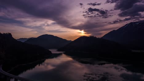 Beautiful-Aerial-Timelapse-of-the-sunrise-over-the-Sylvenstein-Lake,-Bavaria-Germany