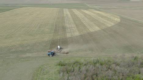 Big-tractor-with-seeding-equipment-turning-around-on-headland-in-zero-till-field