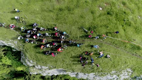 Aerial-top-down-shot-of-famous-Enduro-Biking-Race-on-green-Jura-Mountains-in-France-during-summer