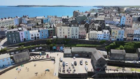 Tenby-Seaside-town-in-Pembrokeshire,-Wales,-rising-drone-footage-