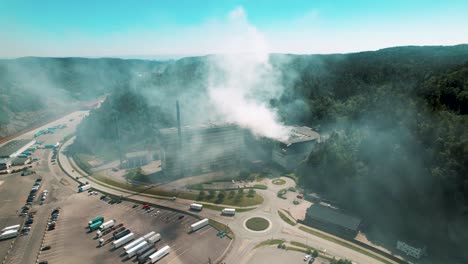 Drone-shots-of-an-fire-due-to-an-explosion-in-a-garbage-recycling-station-in-Kristiansand,-Norway