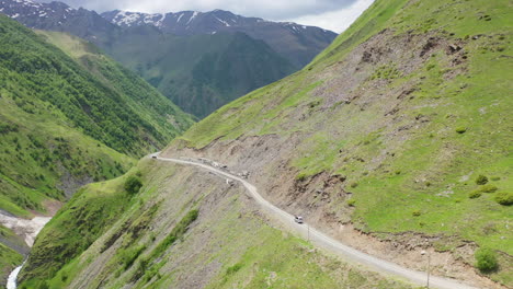 Drone-shot-of-a-road-in-the-Caucasus-mountains-leading-to-Juta-Georgia