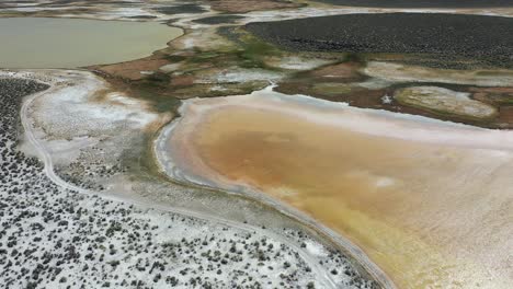 Aerial-View-of-Salt-Flats-in-Californian-Desert,-Strange-Patterns-in-Landscape,-Orbiot-Drone-Shot