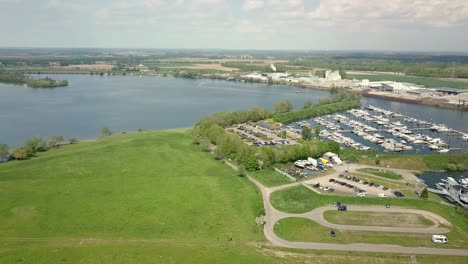 Aerial-drone-view-of-the-beautiful-landscape-of-the-Netherlands-and-small-harbor-in-the-countryside