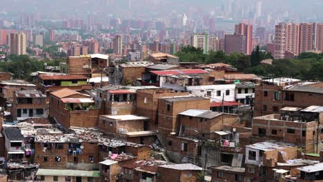 Shanty-Town-in-Medellin,-Colombia-with-Skyline-in-Background