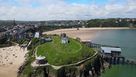 Tenby-Lifeboat-Station-and-castle-Pembrokeshire,-Wales,-Aerial-4K-footage