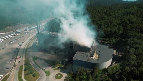 Drone-shots-of-an-fire-due-to-an-explosion-in-a-garbage-recycling-station-in-Kristiansand,-Norway