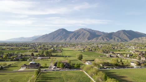 Aerial-View-Over-Mapleton,-Utah---Wasatch-Mountains-In-Background
