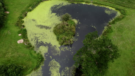 An-aerial-view-of-small-fishing-pools-in-the-Worcestershire-countryside,-England