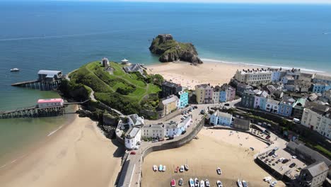 Tenby-Seaside-town-in-Pembrokeshire,-Wales,-Aerial-4K-footage-high-reveal-of-beach-and-harbour