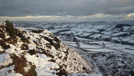 North-York-Moors-Snow-Scene-Video,-Sun-on-rocky-snow-covered-outcrop,-Castleton,-Westerdale,-Rosedale,-Clip-6