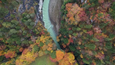 Amazing-blue-canyon-river-in-autumn-forest,-top-view