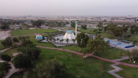 City-skyline-of-Dammam-city-and-beautiful-Life-park,-aerial-view