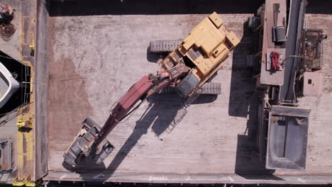 Top-View-Of-Loader-Crane-Unloading-Sand-In-Sliding-Machine-From-Sam-Laud-Freighter